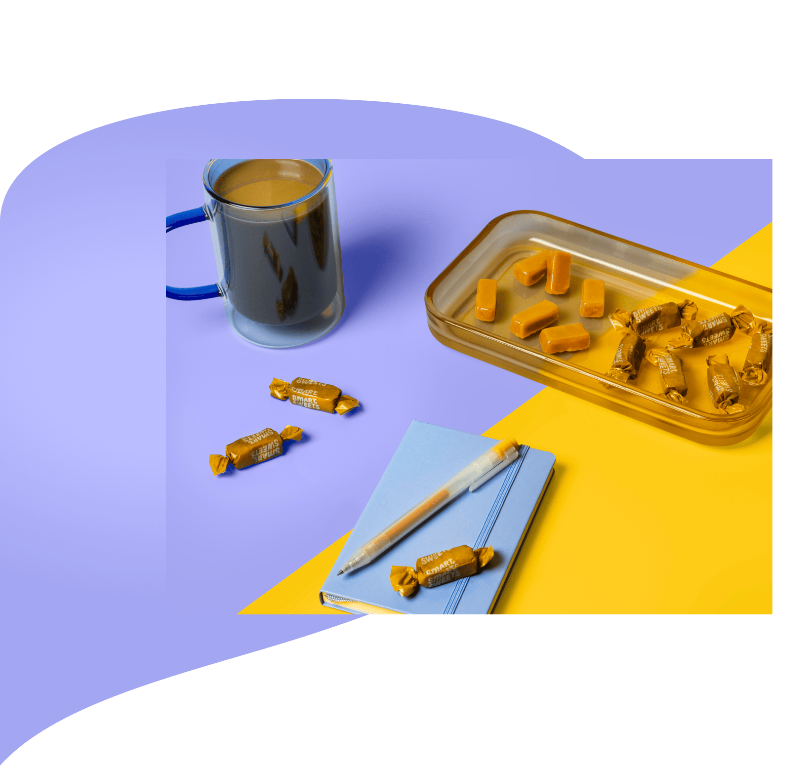 Caramels in tray with mug and notebook on the side