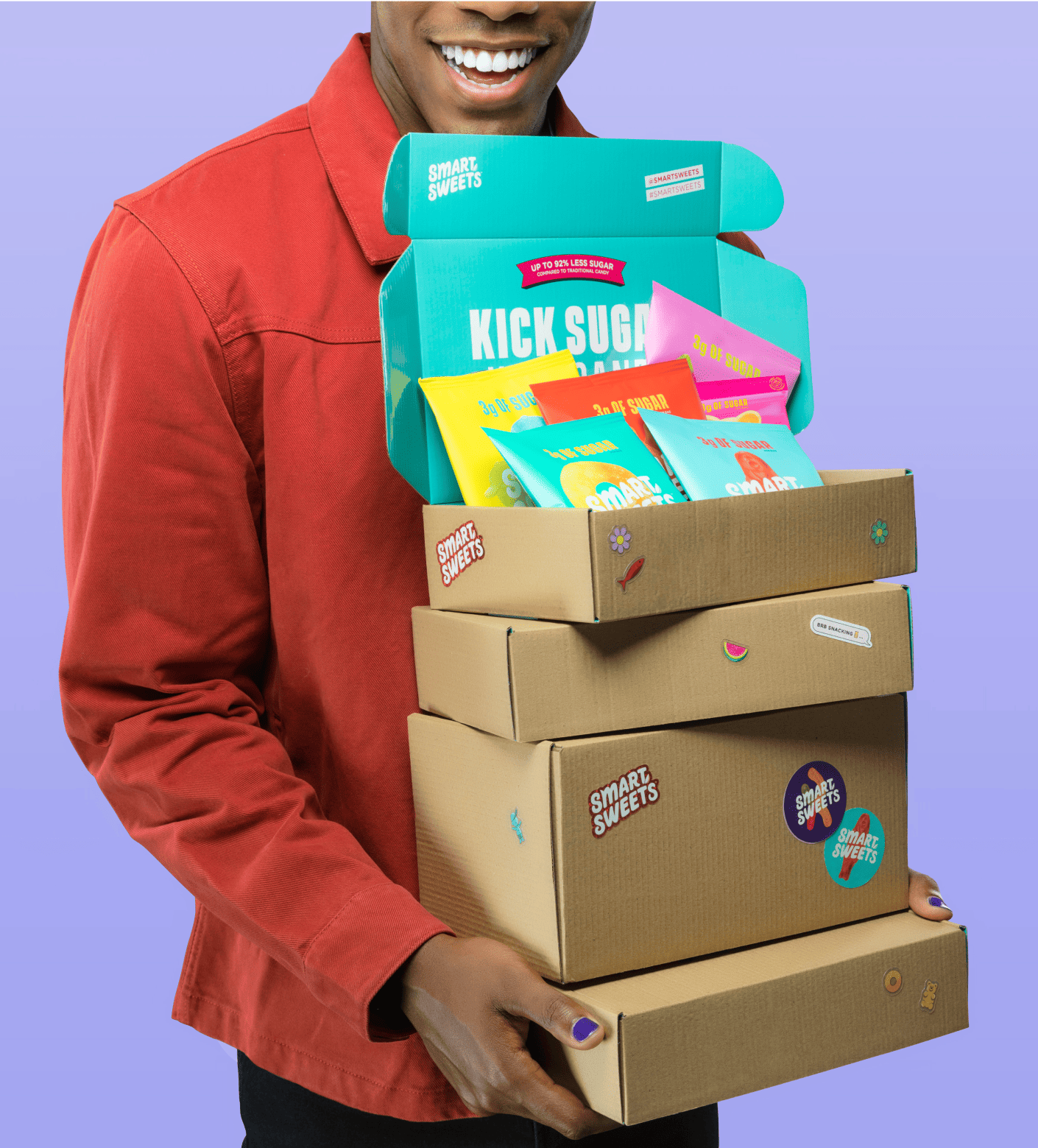 Man carrying boxes of SmartSweets candy