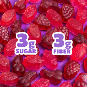 Assorted fruit gummies on green background. Text: 3g SUGAR, 3g FIBER.