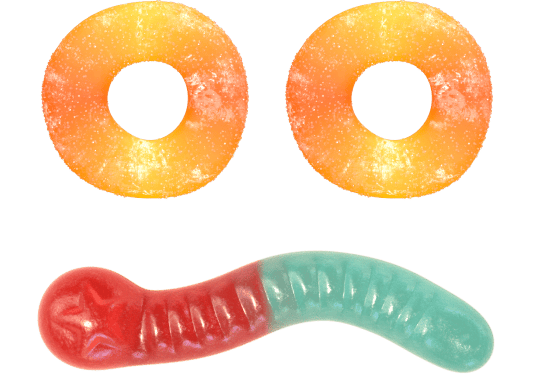 Two peach rings and one red blue gummy worm